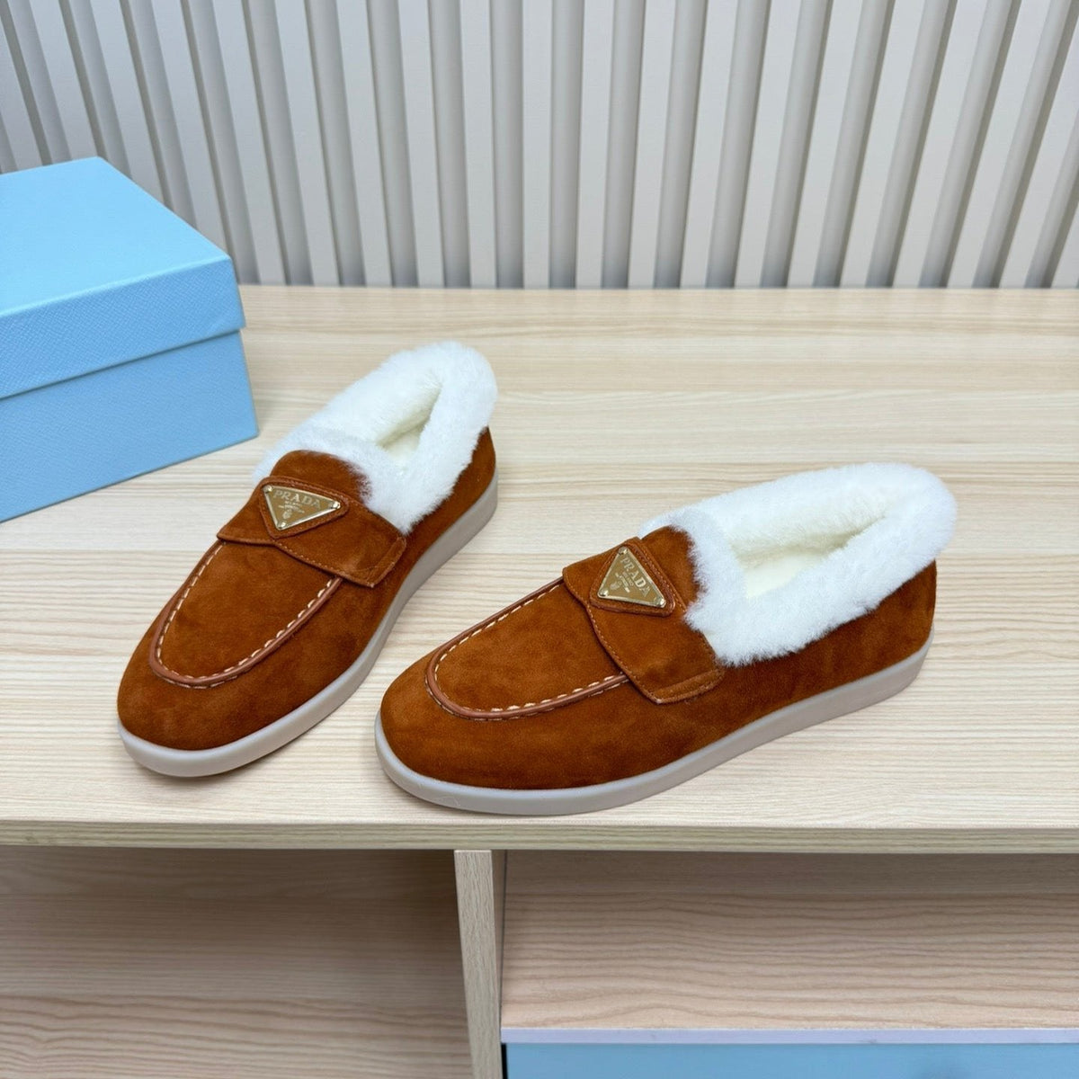 LOAFER IN RED BROWN SUEDE AND FUR LINING ATTACHED TRIANGLE LOGO