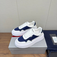 PRADA 25S DOWNTOWN BOLD SNEAKERS 45MM IN WHITE AND NAVY BLUE CALFSKIN