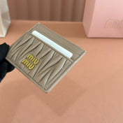MM MATELASSÉ CARD HOLDER 10.5 IN BEIGE CALFSKIN