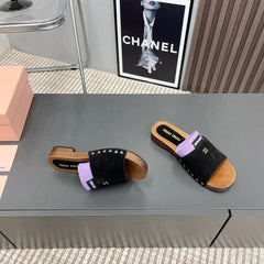 SLIPPERS IN BLACK SUEDE WITH PURPLE HALF-FOOT SOCKS