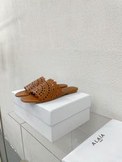 ALAIA VIENNE FLAT MULES IN CHOCOLATE BROWN LAMBSKIN