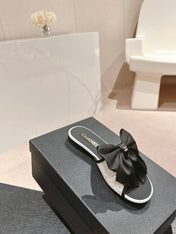 BOW LADY SLIPPERS BLACK LAMBSKIN WITH WHITE RHINESTONES