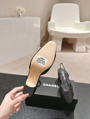 HIGH SLINGBACKS IN BLACK LAMBSKIN AND SATIN