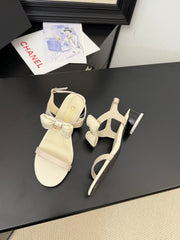 FLAT SANDALS IN WHITE CALFSKIN WITH BOW