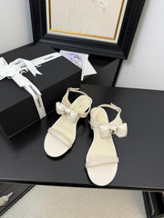 FLAT SANDALS IN WHITE CALFSKIN WITH BOW