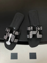 HM 25S ORAN SANDAL IN BLACK LAMBSKIN WITH WHITE STONE DETAILS