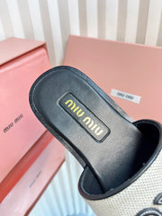 SLIDES SANDALS IN BLACK CALFSKIN AND WHITE STRAW WOVEN