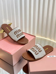 SLIDES SANDALS IN BROWN STRAW WOVEN