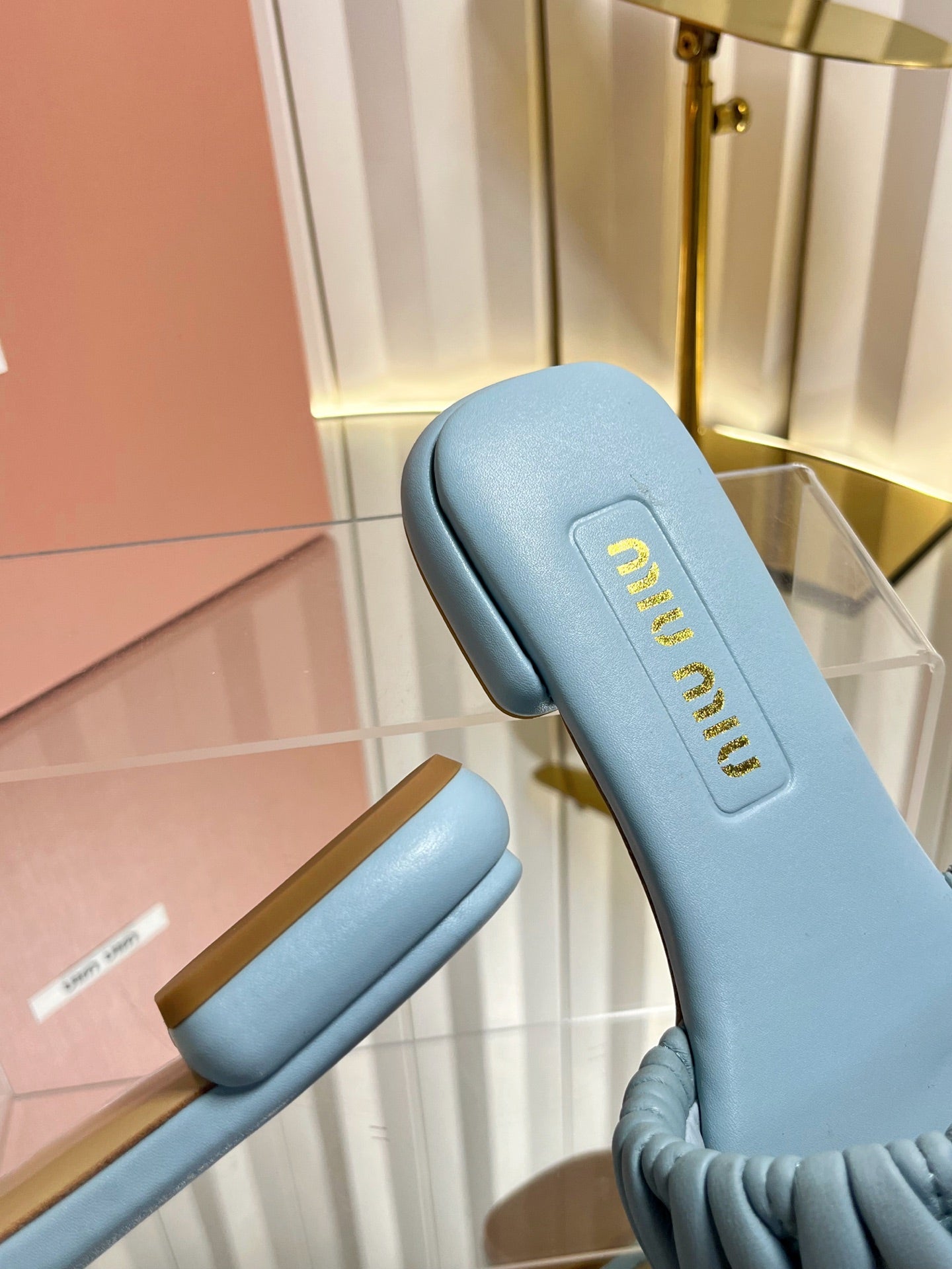 MIUMIU 26S MATELASSE SLIDES IN LIGHT BLUE CALFSKIN GOLD HARDWARE