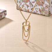 CD 26S PEARL CHAIN DROP LOGO NECKLACE IN GOLD TONE METAL WITH WHITE RESIN PEARL & CRYSTAL 631060