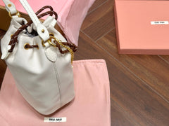 DRAWSTRING BUCKET BAG 21 IN WHITE CANVAS GOLD HARDWARE