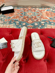 FLAT SLIPPERS IN WHITE LAMBSKIN AND WOVEN WITH LOGO
