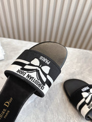 DIOR FLAT SLIDES 25S IN BLACK CALFSKIN AND FABRIC BRAND NAME EMBROIDERY