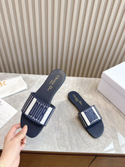 DIOR FLAT SLIDES 25S IN MIDNIGHT BLUE CALFSKIN AND FABRIC BRAND NAME EMBROIDERY