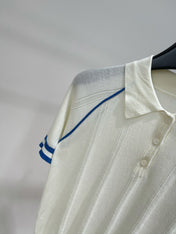 MIUMIU SHORT-SLEEVE RAGLAN POLO SHIRT IN BLUE AND WHITE 267966