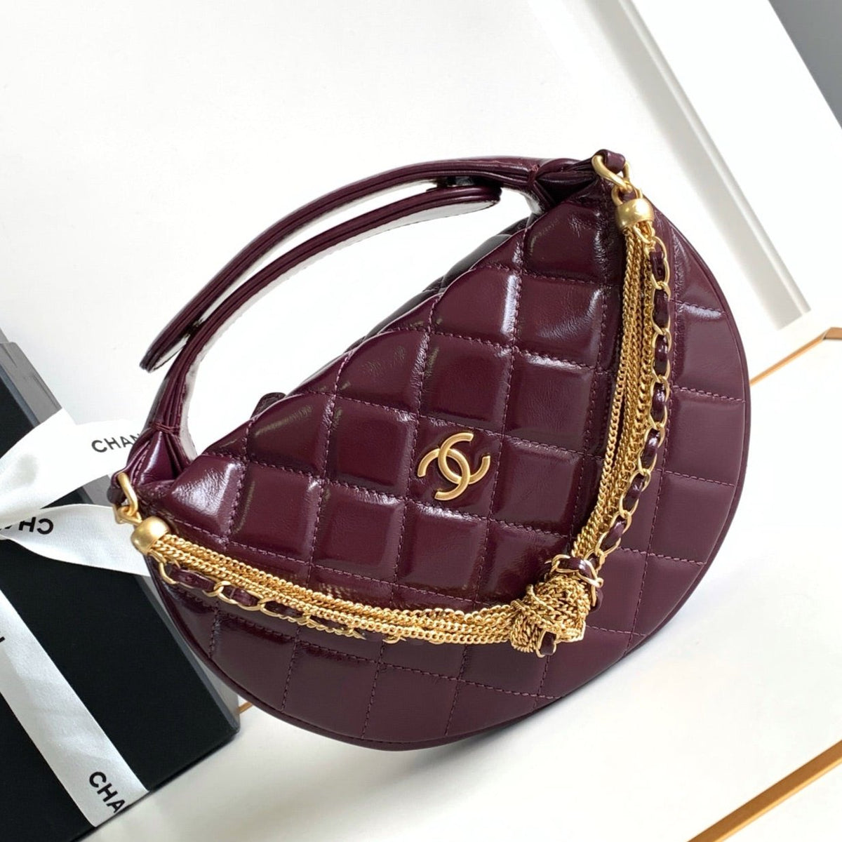 CC 16 MINI POUCH IN DARK RED WINE GRAINED CALFSKIN AND GOLD METAL