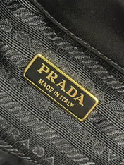 BUCKET BAG 19 IN BLACK RE-NYLON AND CALFSKIN HANDLE