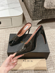 ALAIA SPIKE JEWEL MULES IN BLACK GLOSSY CALFSKIN