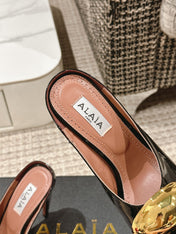 ALAIA SPIKE JEWEL MULES IN BLACK GLOSSY CALFSKIN WITH GOLD HARDWARE