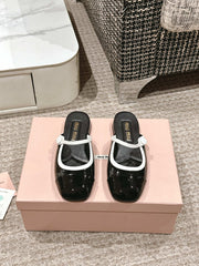 FLAT MULE IN BLACK AND WHITE PATENT CALFSKIN