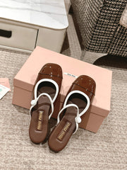 FLAT MULE IN CHOCOLATE BROWN PATENT CALFSKIN