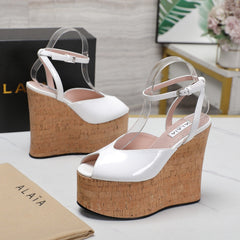 ALAIA WEDGE SANDAL IN WHITE GLOSSY CALFSKIN AND BEIGE RUBBER