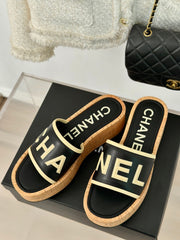THICK SOLE LETTER SLIPPERS IN BLACK SHEEPSKIN