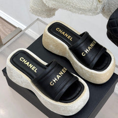 PLATFORM SLIPPERS IN BLACK LAMBSKIN