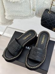 THICK SOLE WEDGE SLIPPERS IN BLACK CALFSKIN