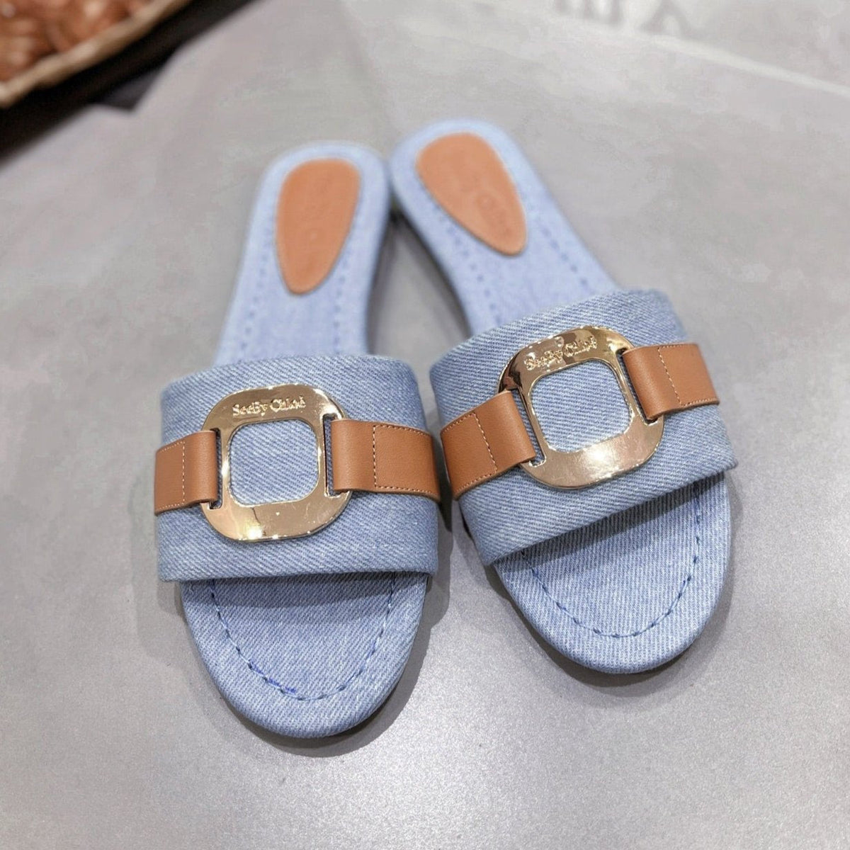 SLIDE MULE IN LIGHT BLUE DENIM AND BROWN CALFSKIN GOLD HARDWARE
