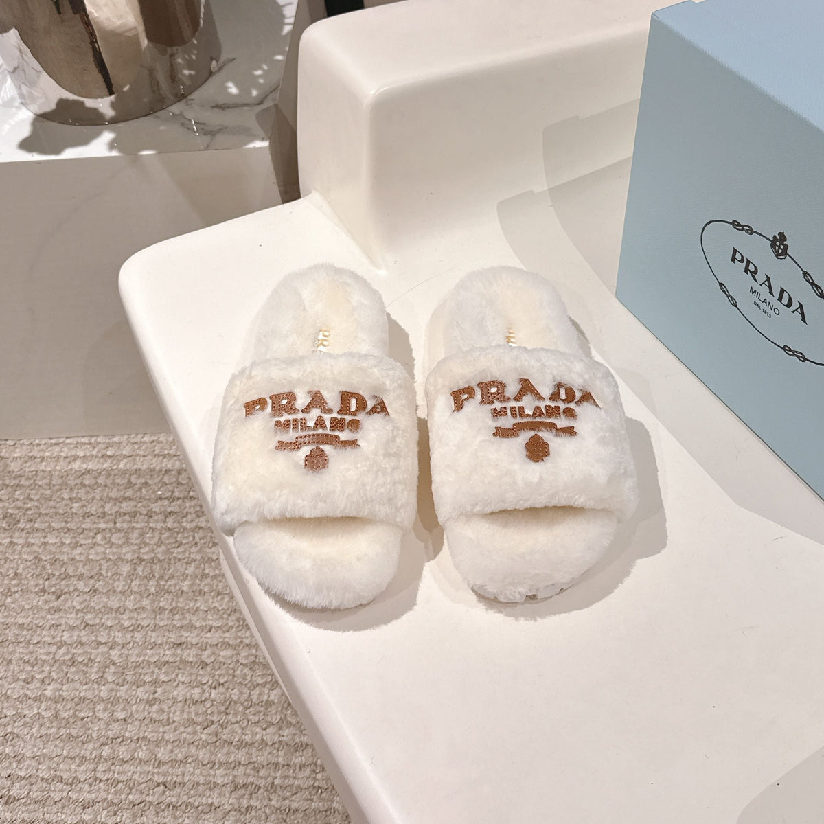 PRADA 25S FLAT MULES IN WHITE RABBIT FUR
