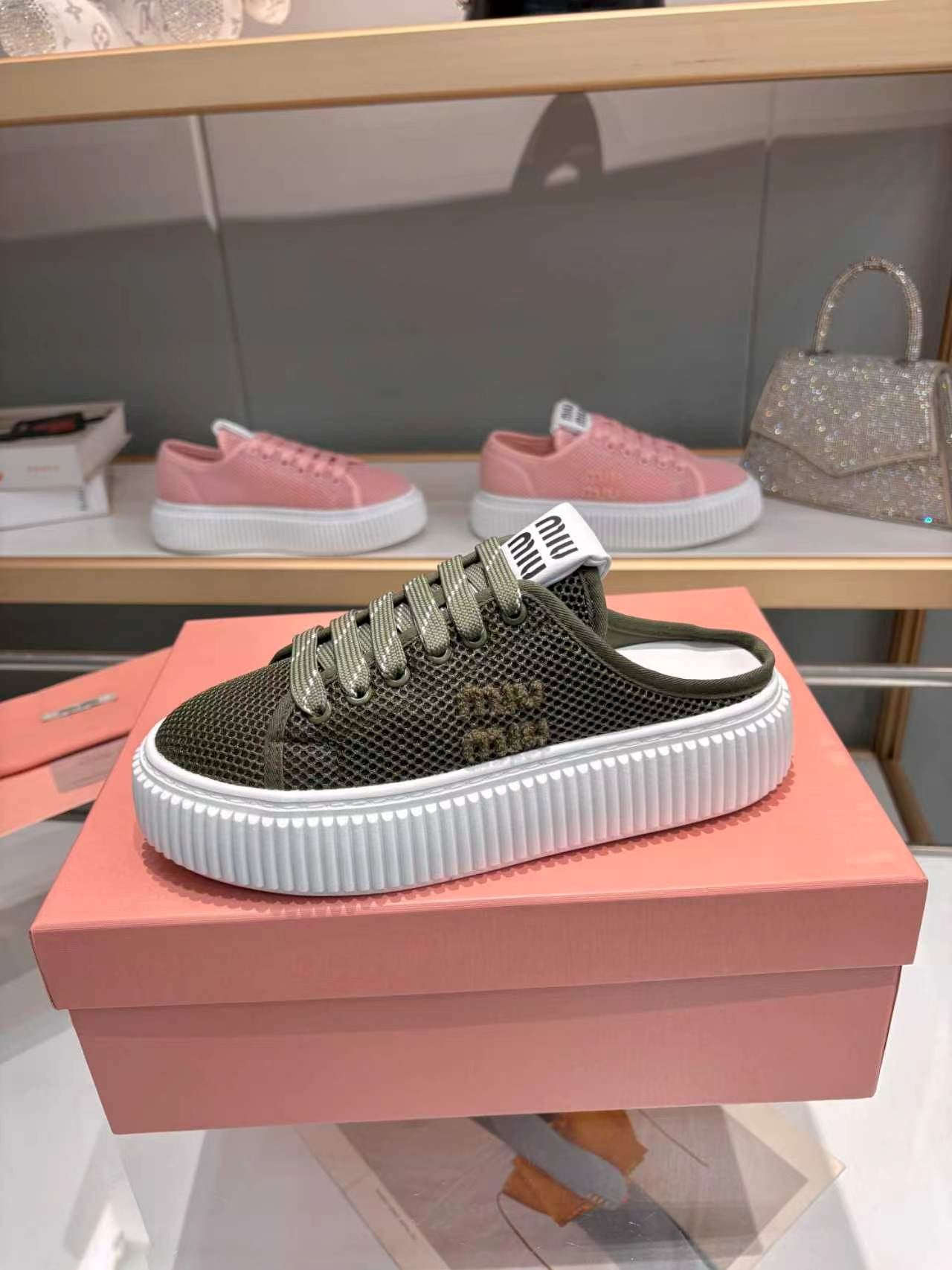 MIUMIU 26S SNEAKER MULES 45MM IN DARK OLIVE GREEN MESH