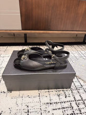 FLAT SLINGBACKS IN BLACK CALFSKIN