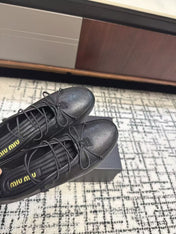 MIUMIU 26S LACE UP BOW LOAFERS IN BLACK CALFSKIN