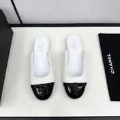 BOW MULE IN WHITE FUR AND BLACK CALFSKIN