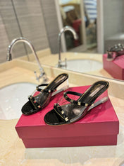 ROCKSTUD MULE SANDALS IN BLACK CALFSKIN AND TRANSPARENT PVC FILM