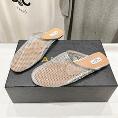 ALAIA FLAT MULES IN SILVER MESH FISHNET