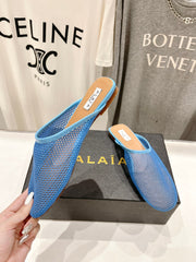 ALAIA FLAT MULES IN CERULEAN BLUE MESH FISHNET