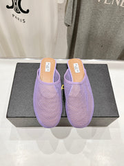 ALAIA FLAT MULES IN LIGHT PURPLE MESH FISHNET